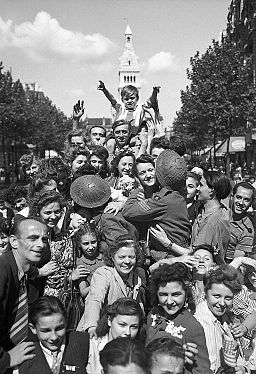 Cheering crowds greet British troops in Paris, 26 August 1944. BU21