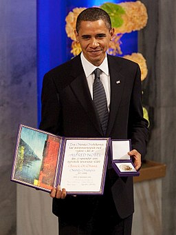 President Barack Obama with the Nobel Prize medal and diploma